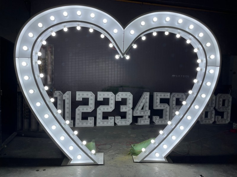 Heart-shaped marquee light with warm-white bulbs