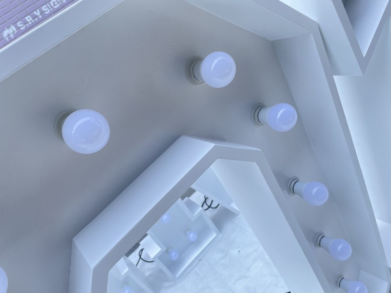 Inside a letter showing socket wiring along the frame